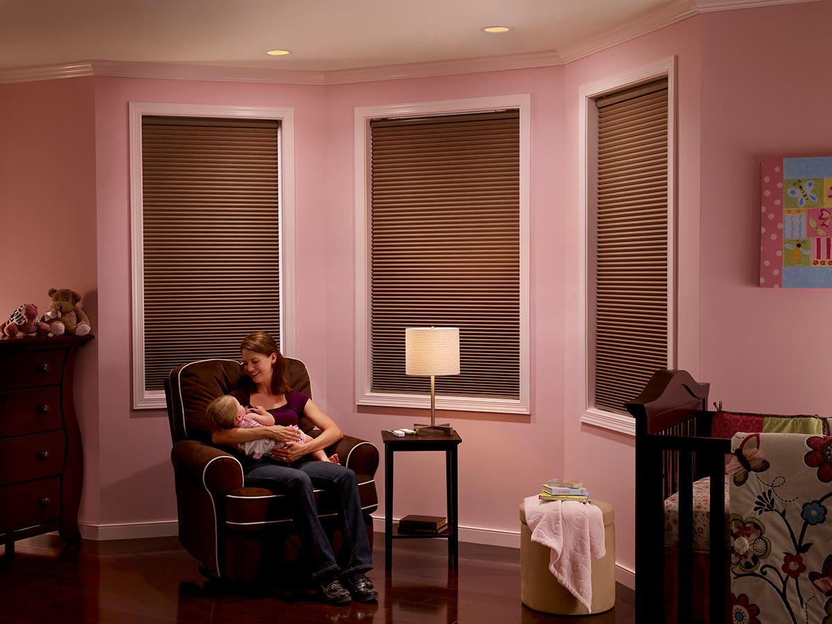 Mother and Baby in Nursery with Closed Room-Darkening Honeycomb Shades