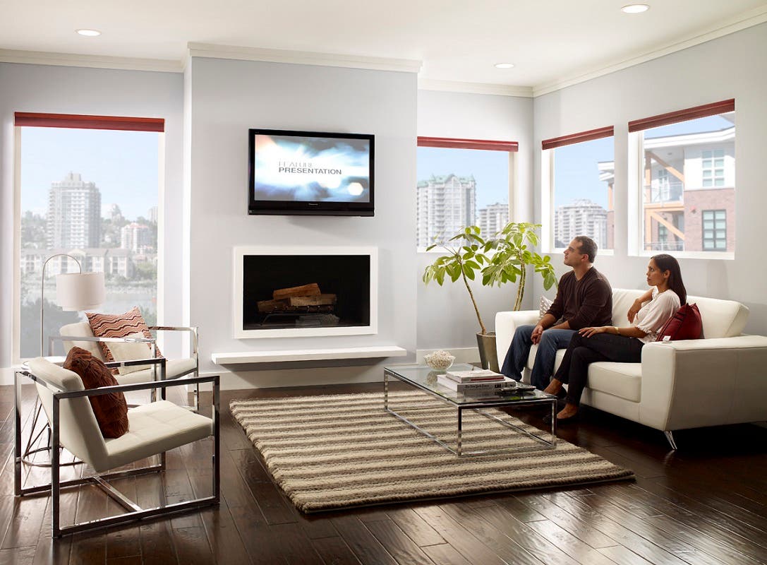 Man and Woman Sitting in Media Room with Open Honeycomb Shades